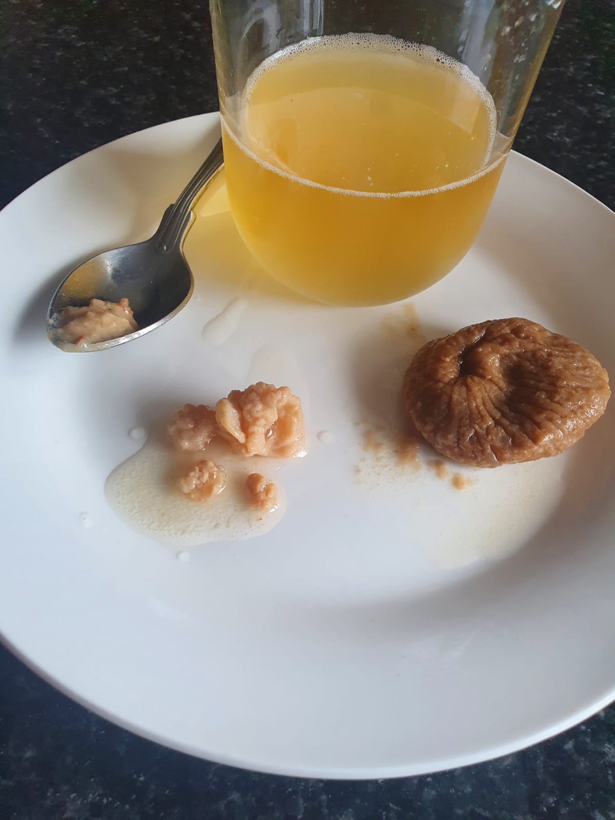 Water Kefir Grains and glass of Kefir with fig